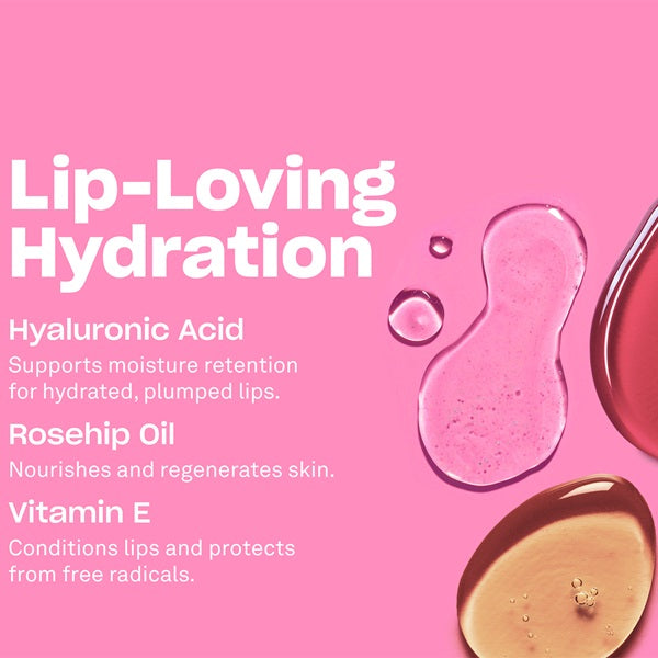 Pink promotional graphic for a lip product called Lip-Loving Hydration, with white text listing ingredients: Hyaluronic Acid, Rosehip Oil, and Vitamin E. Visual elements include glossy pink and amber liquid droplets on a solid pink background.