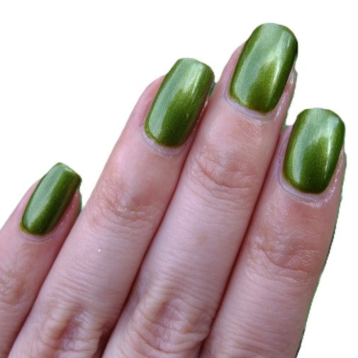 Green shimmery nails with fingers and a white background.
