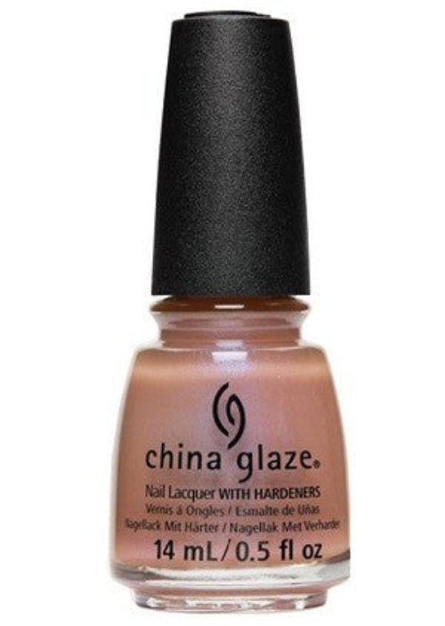 A bottle of China Glaze nail polish in a beige color with a black cap and a label showing the brand and color name.
