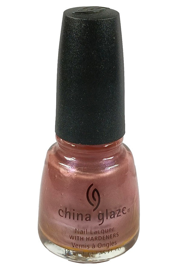 A bottle of China Glaze nail polish in a metallic pink shimmer shade, with a black cap.