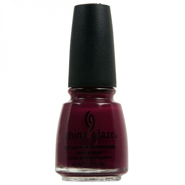 A bottle of China Glaze nail polish in a deep berry red shade, with a black cap.