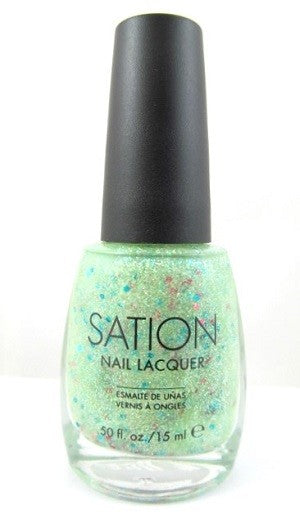 A bottle of Sation nail polish in a light celery green color with gold glitter and larger multi colored hex glitter, translucent light green base.