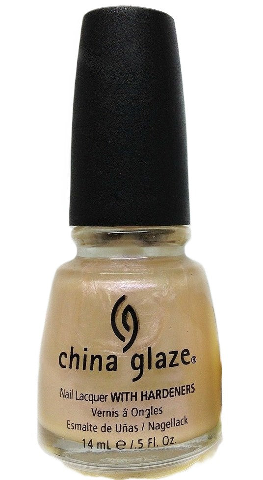 A bottle of China Glaze nail polish in a semi-sheer pale gold color with a black cap.