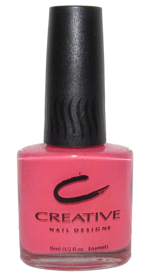 A bottle of Creative Nail Design nail polish in vivid coral pink color.