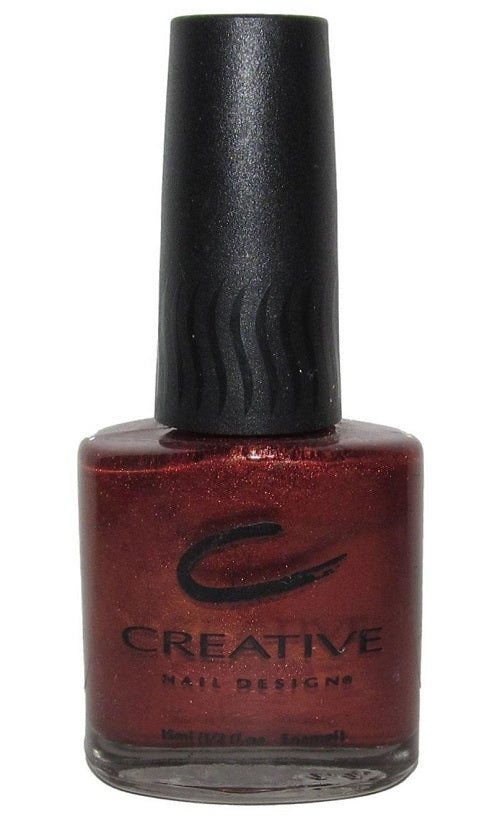 A bottle of Creative Nail Design nail polish in Cedar shade with a deep red color and shimmer finish.