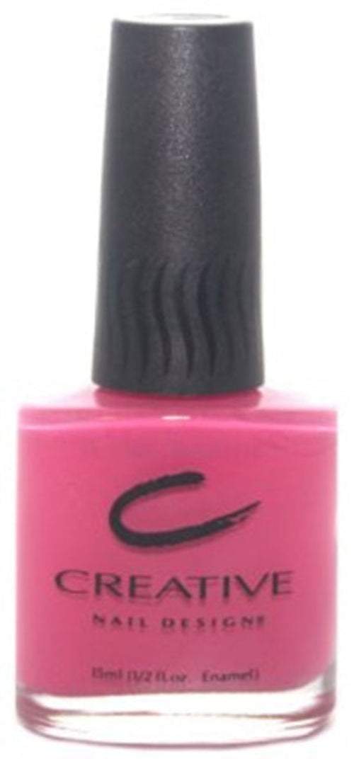 A bottle of Creative Nail Design nail polish in bright rosy pink color, with a black cap.