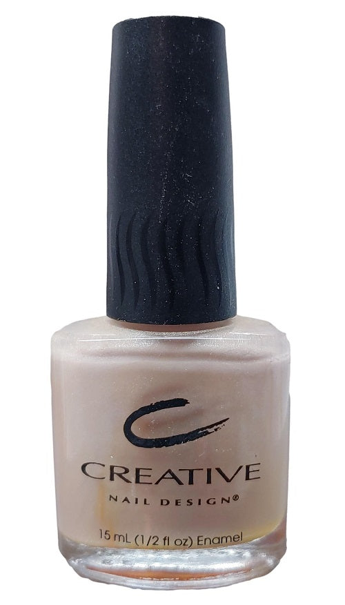 A bottle of Creative Nail Design nail polish in the shade Creme Brulee 196 with a champagne nude shimmer color.