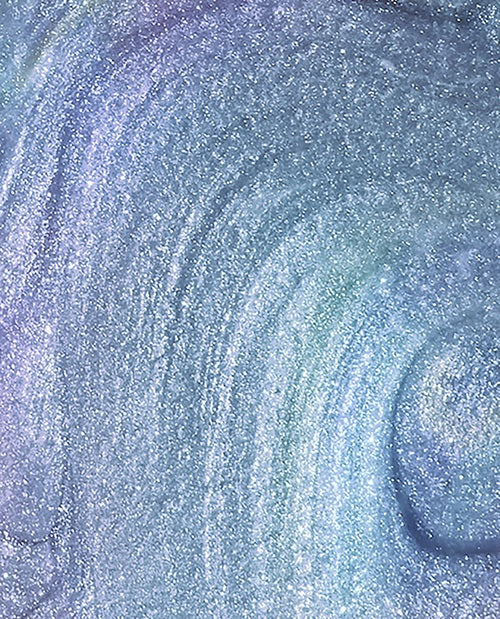 Close-up of a blue shimmer nail polish swatch with swirling patterns