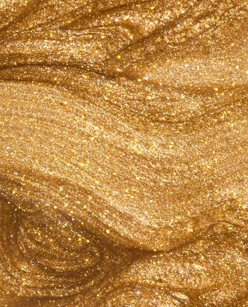 Close-up of gold glittery nail polish swatch