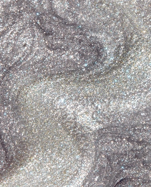 Close-up of a silver shimmer nail polish swatch