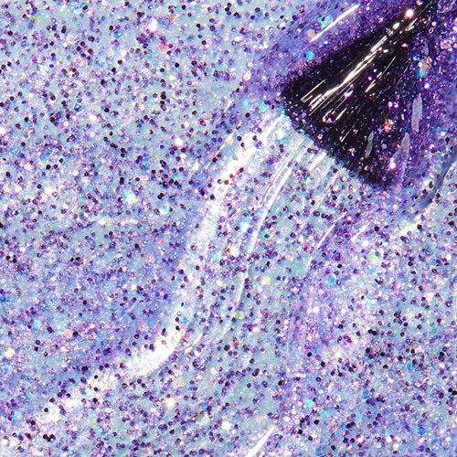 Close-up of a glittery purple nail polish swatch with brush.
