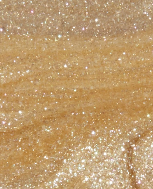 Close-up of gold glittery nail polish swatch