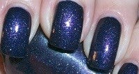 Deep blue nail color with a micro-glitter effect painted on nails.