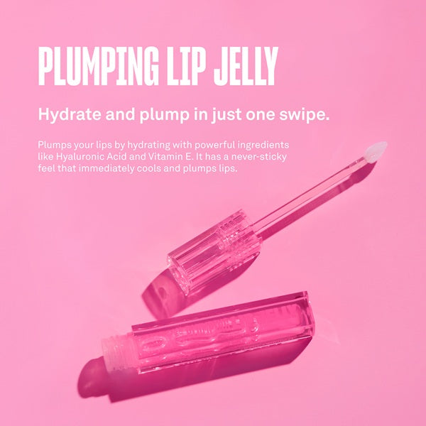 Plumping lip jelly with applicator on a pink background