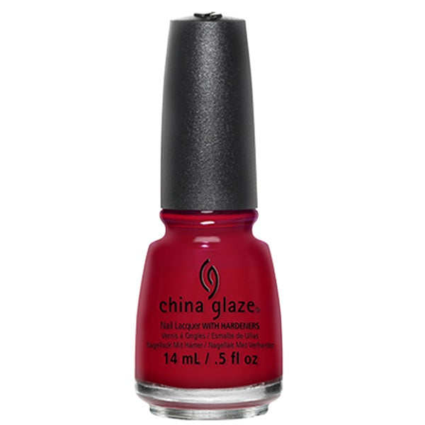 Red nail polish bottle with black cap on a white background