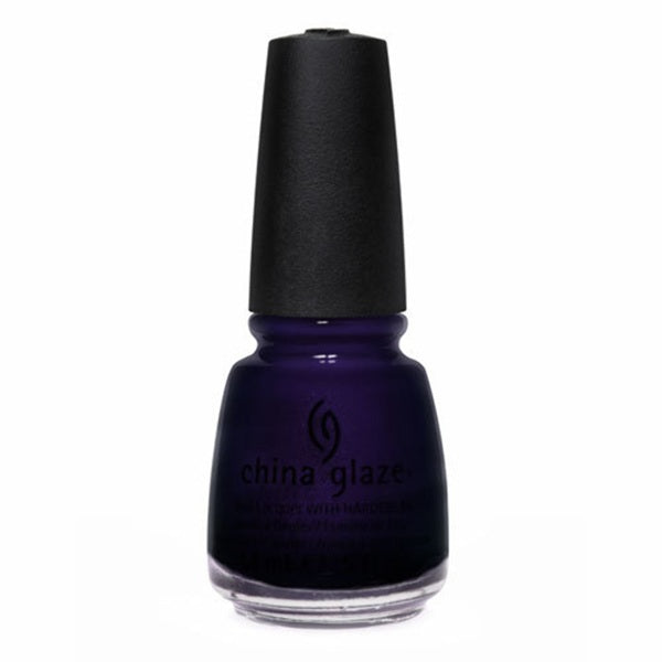China Glaze deep indigo blue nail polish bottle with black cap on a white background.