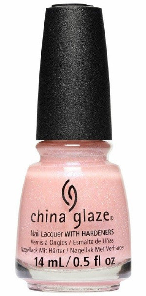 A bottle of China Glaze nail polish in a sheer pink shade with violet blue shimmer, with a black cap.