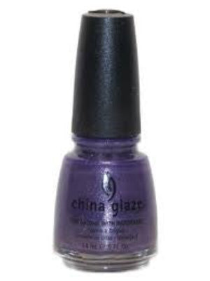 A bottle of China Glaze nail polish in a purple color with a silver glass fleck shimmer, labeled as 'Grape Juice 717'.