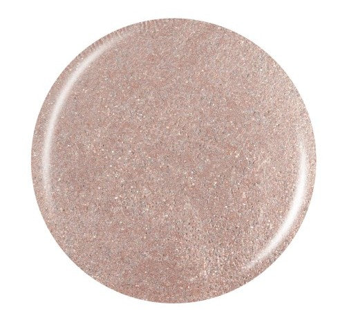 Round champagne gold shimmer nail polish swatch against a white background.