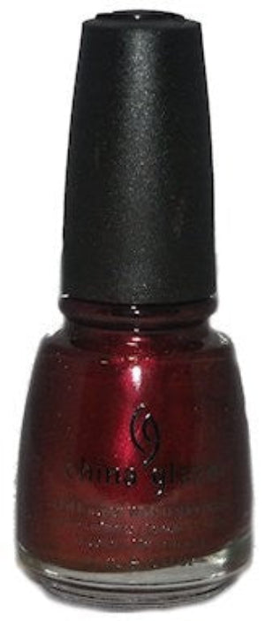 A bottle of Chica Glaze nail polish in a deep metallic burgundy red shade, featuring a black cap and the brand logo on the front.