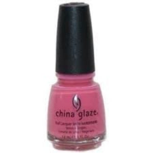 A bottle of China Glaze nail polish in a bright pink color, with the brand name and shade indicated on the label.