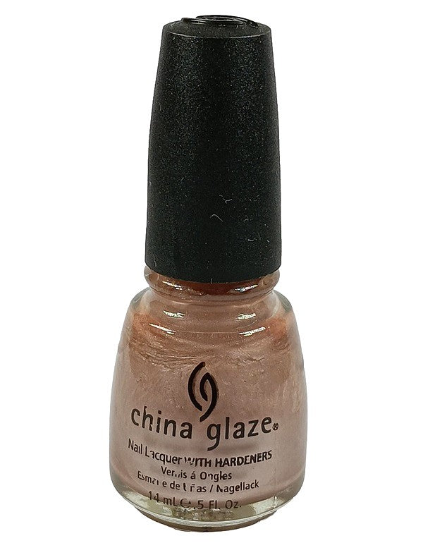 A bottle of China Glaze nail polish in a deep gold shimmer color.