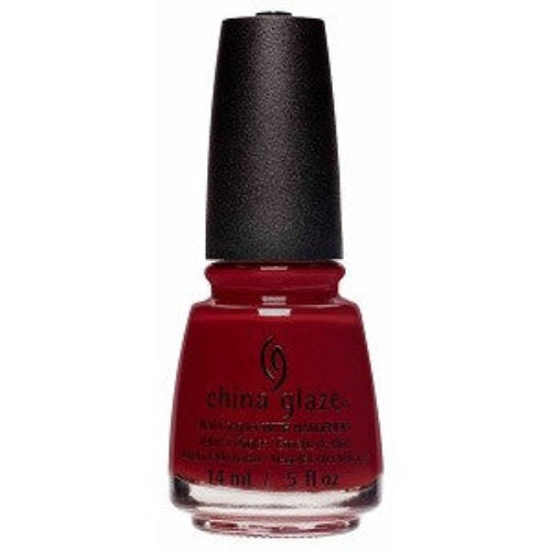A bottle of China Glaze nail polish in a deep red color with a black cap.