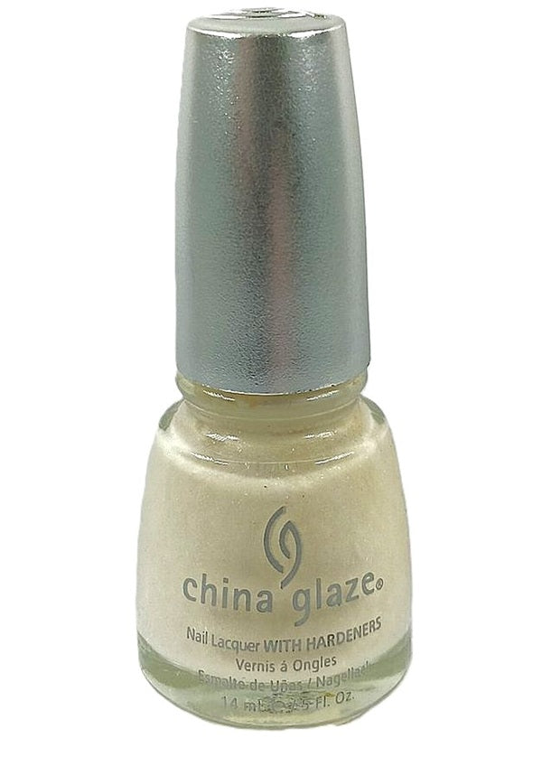 A bottle of China Glaze nail polish in a semi-sheer off-white shimmer color.