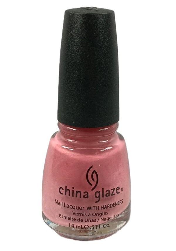 A bottle of China Glaze nail polish in a medium berry pink color with a black cap.