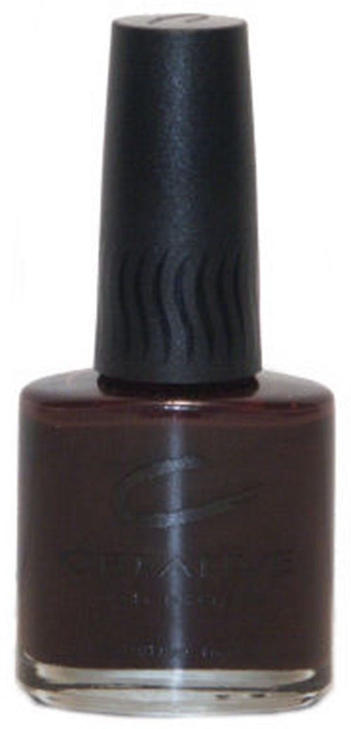 A bottle of Creative Nail Design nail polish in dark chocolate brown color with the cap on.