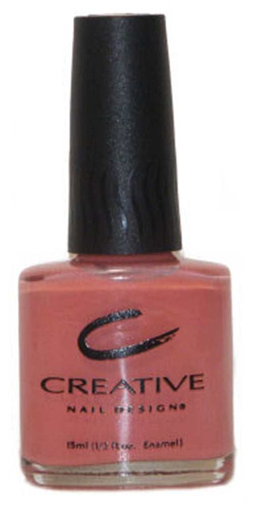 A bottle of Creative Nail Design nail polish in a shade with peach and orange undertones, labeled 'Inspire 395'.
