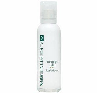 A bottle of CND SpaPedicure Massage Silk, 4 oz size, with a white label and green branding text.