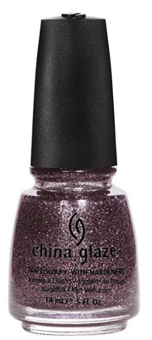 A bottle of China Glaze nail polish with dense dusty purple glitter mixed with gold, silver, and bronze micro-glitter. With black cap on a white background.