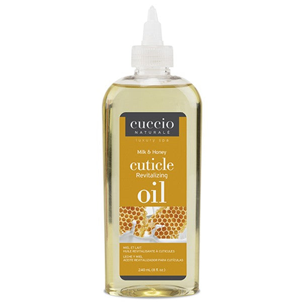 Cuccio Naturale Cuticle Oil in a clear plastic bottle with a white cap. The label shows the product name and mentions it is a Milk & Honey scent.