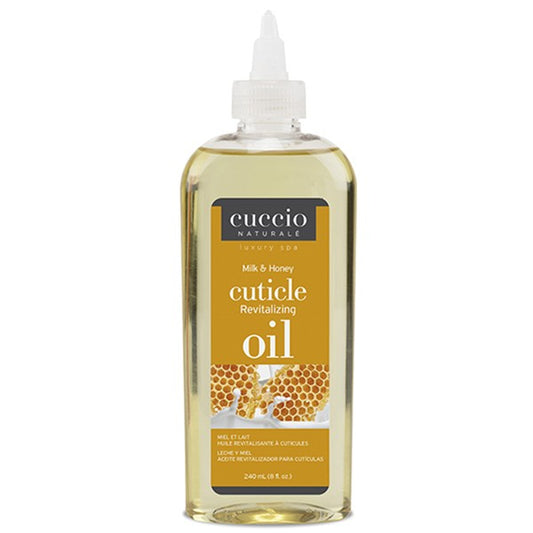 Cuccio Naturale Cuticle Oil in a clear plastic bottle with a white cap. The label shows the product name and mentions it is a Milk & Honey scent.