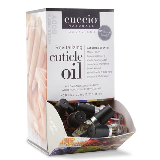 Box of Cuccio Naturale Revitalizing Cuticle Oil with assorted scents, featuring mini travel-size bottles.