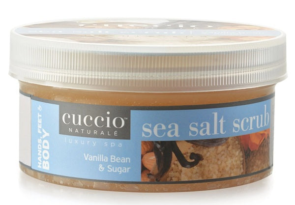 Cuccio Naturale sea salt scrub container with vanilla bean and sugar imagery on a white background