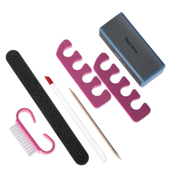 Set of nail care tools including a file, brush, and pink stand on a white background.