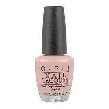A bottle of OPI Nail Polish in a Romantic Retreat color, which is a sheer almond-toned ivory creme