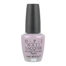 A bottle of OPI Nail Polish in a light pink color with a black label and the brand name visible.