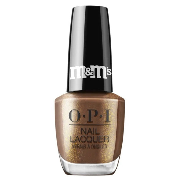 OPI light brown nail polish with gold shimmer, and a black cap with M&M's written on it.