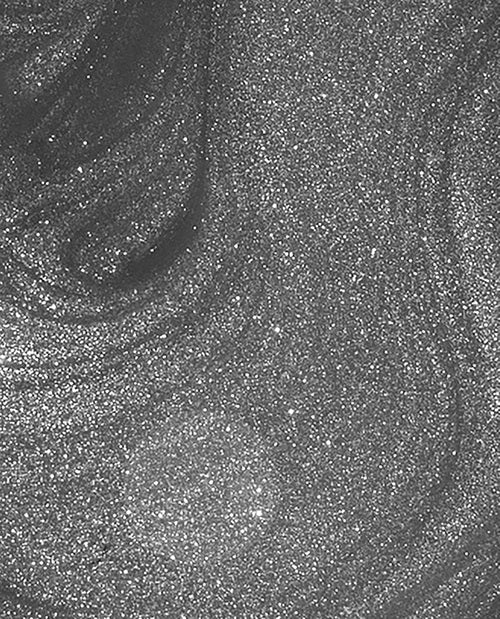 Close-up of a gray shimmer nail polish swatch.