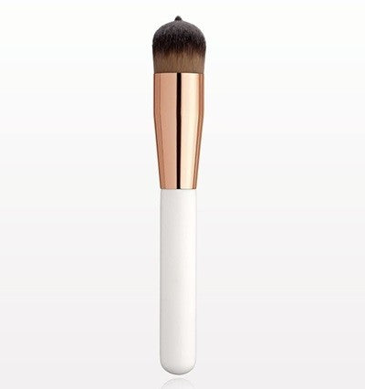 A professional makeup brush with a matte white handle and a rose gold-colored ferrule, designed for foundation application.