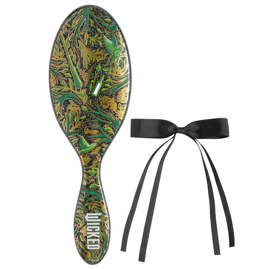 Decorative hairbrush with green paisley pattern and black ribbon on a white background