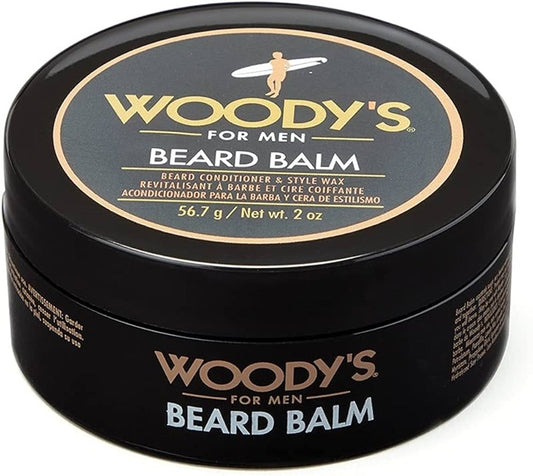 A black round tin of Woody's For Men Beard Balm, featuring a black lid with a gold and white circular label and a black body with gold and white text.