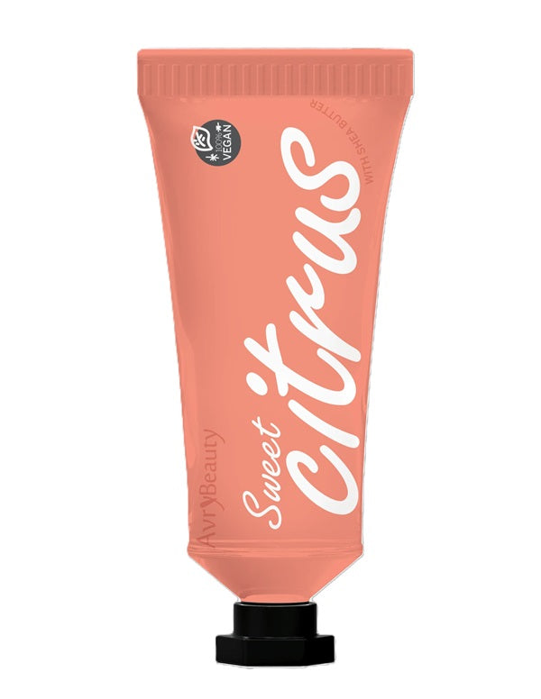 A tube of Avry Shea Butter Lotion with an orange color and white text displaying the brand name and product description.