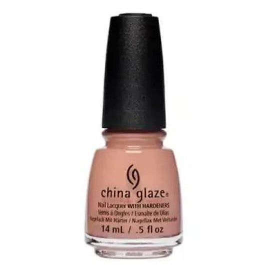 A bottle of China Glaze beige nail polish with black cap.