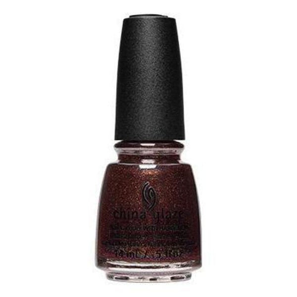 Bottle of dark mulberry wine China Glaze nail polish with a shimmery finish on a white background