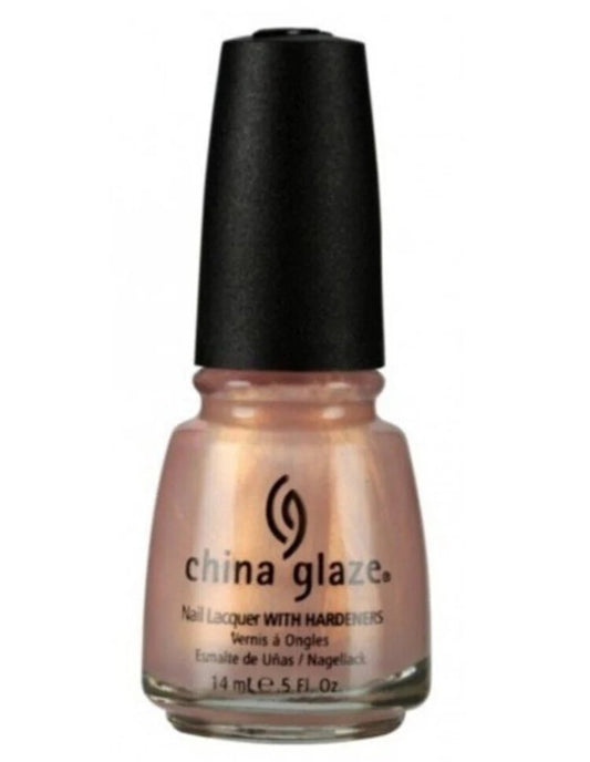 China Glaze golden beige shimmery nail polish bottle with black cap against a white gackground.