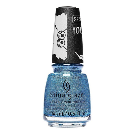 China Glaze nail polish bottle with blue glittery polish on a white background